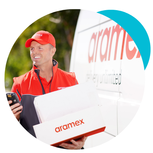 An Aramex worker. A delivery driver with packages, in front of a delivery van, in uniform.